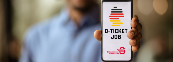 Mann hält Handy in Kamera auf dem Deutschlandticket Job von STE sichtbar ist